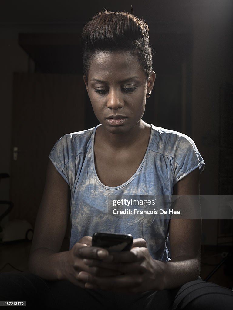 Young black woman at her apartment