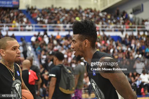 Recording artist Chris Brown and NBA player Iman Shumpert attend LudaDay Weekend Annual Celebrity Basketball Game at Georgia State University Sports...