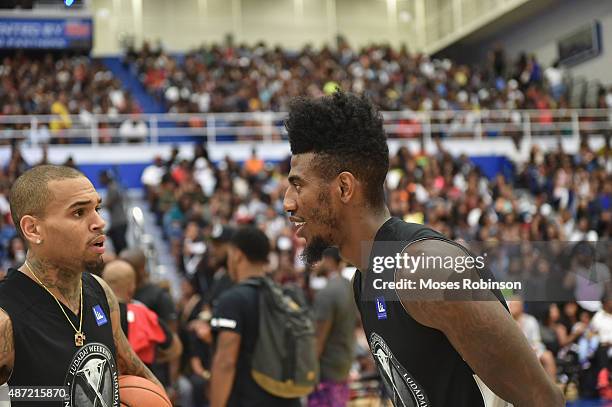 Recording artist Chris Brown and NBA player Iman Shumpert attend LudaDay Weekend Annual Celebrity Basketball Game at Georgia State University Sports...