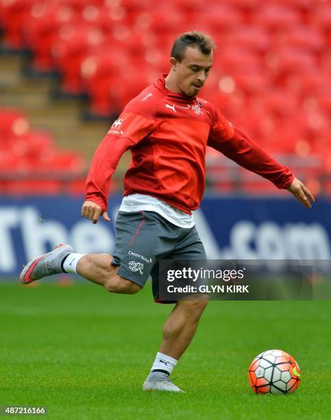 Switzerland midfielder Xherdan Shaqiri takes part in a training session at Wembley Stadium in London on September 7 ahead of their UEFA Euro 2016...