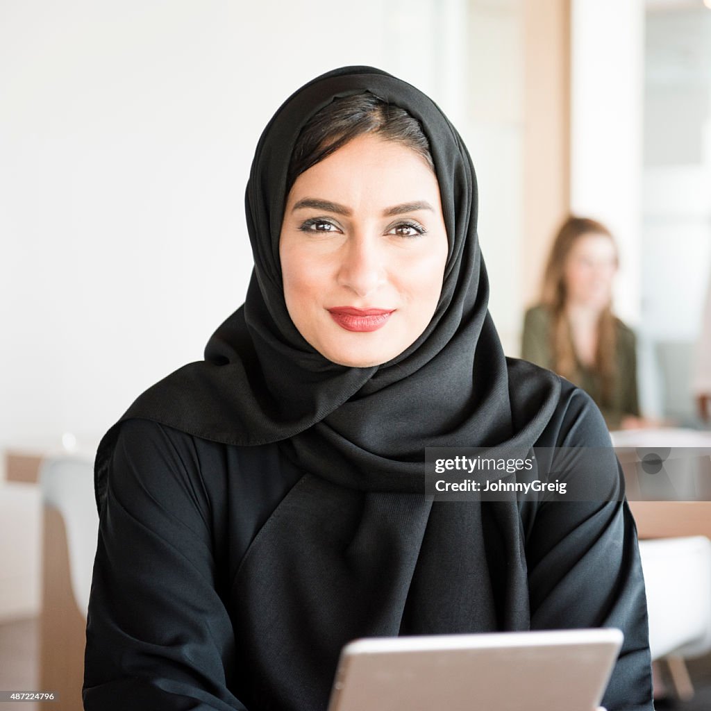 Young Arabic woman in modern office