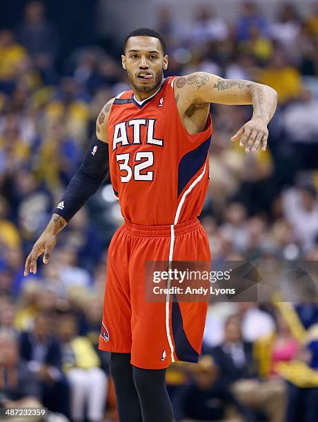 Mike Scott of the Atlanta Hawks celebrates after making a three point shot against the Indiana Pacers in Game 5 of the Eastern Conference...