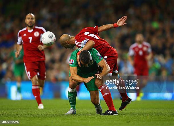 Zurab Khizanishvili of Georgia challenges Jonathan Walters of the Republic of Ireland during the UEFA EURO 2016 Group D qualifying match between...