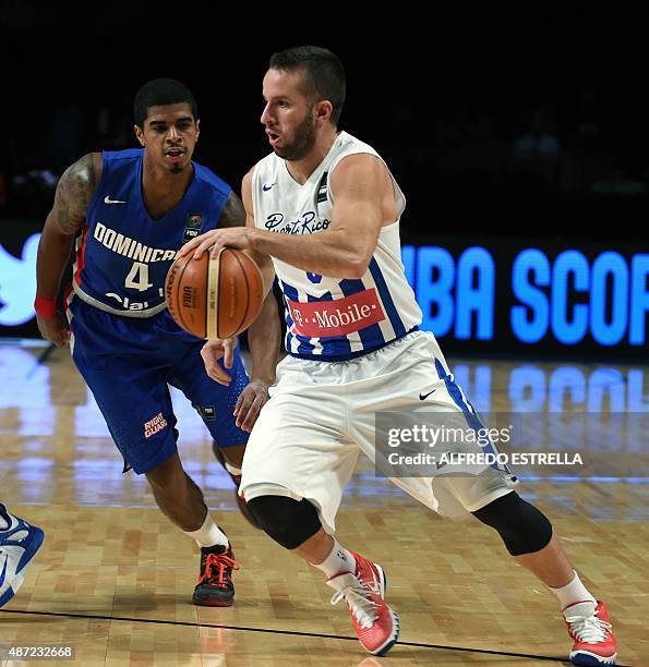 Puerto Rico's guard Juan Berea vies for the ball with Dominican Republic's point guard Edgar Sosa during a 2015 FIBA Americas Championship Men's...