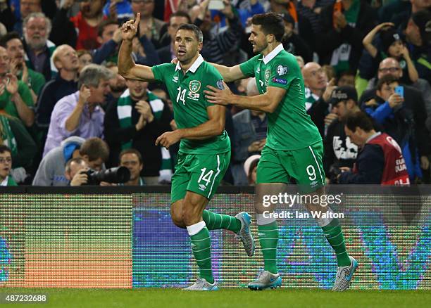 Jonathan Walters of the Republic of Ireland celebrates with Shane Long as he scores their first goal during the UEFA EURO 2016 Group D qualifying...