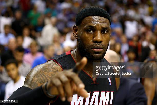 LeBron James of the Miami Heat reacts after defeating the Charlotte Bobcats 109-98 in Game Four of the Eastern Conference Quarterfinals during the...