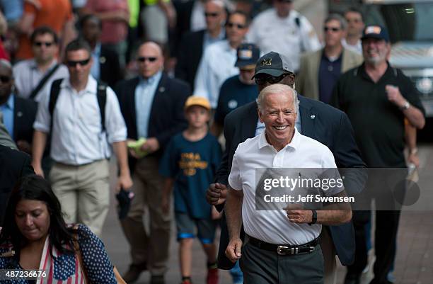 Vice President Joe Biden runs while participating in the annual Allegheny County Labor Day Parade September 7, 2015 in Pittsburgh, Pennsylvania....