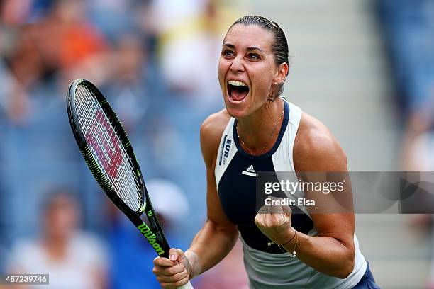 Flavia Pennetta of Italy celebrates after defeating Samantha Stosur of Australia during their Women's Singles Fourth Round match on Day Eight of the...