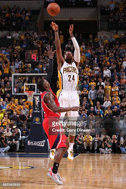 Paul George of the Indiana Pacers takes a shot against the Atlanta Hawks during Game Five of the Eastern Conference Quarterfinals at the Bankers Life...