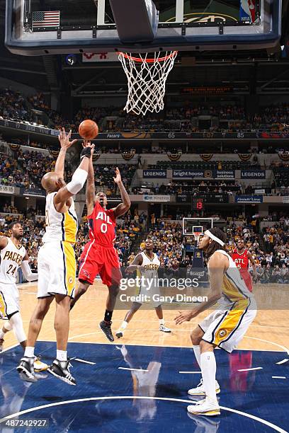 Jeff Teague of the Atlanta Hawks takes a shot against the Indiana Pacers during Game Five of the Eastern Conference Quarterfinals at the Bankers Life...