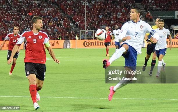 Portugal's Cristiano Ronaldo in action against Albania's Lorik Cana during the Euro 2016 qualifying football match between Albania and Portugal at...