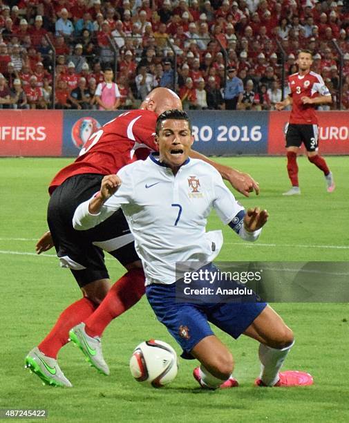 Portugal's Cristiano Ronaldo in action against Albania's Arlind Ajeti during the Euro 2016 qualifying football match between Albania and Portugal at...