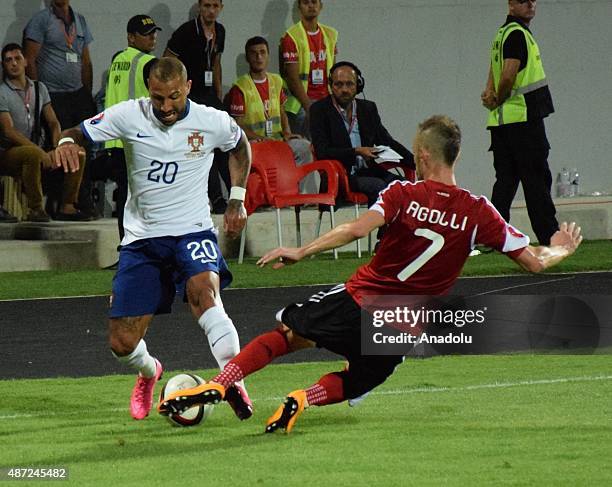 Portugal's Ricardo Quaresma in action against Albania's Ansi Agolli during the Euro 2016 qualifying football match between Albania and Portugal at...