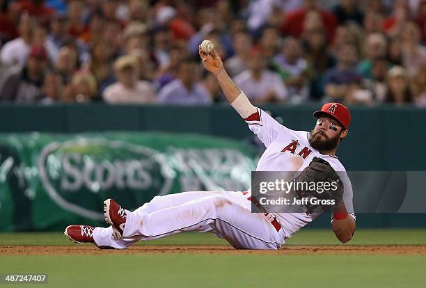 Third baseman Ian Stewart of the Los Angeles Angels of Anaheim isn't able to throw Carlos Santana of the Cleveland Indians out after making a diving...