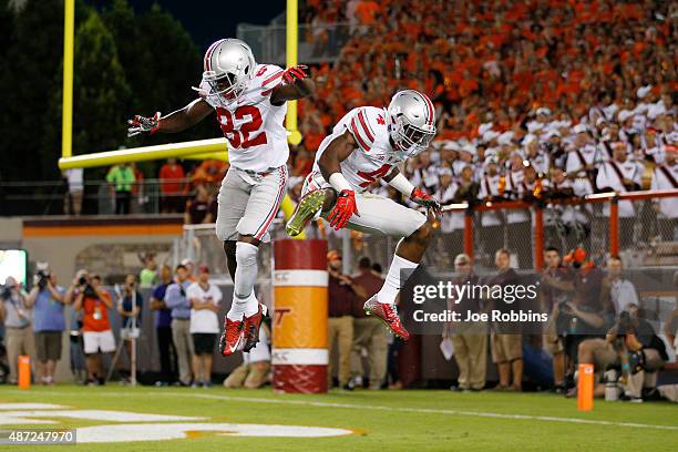 Curtis Samuel of the Ohio State Buckeyes celebrates with James Clark after a 24-yard touchdown reception in the first quarter against the Virginia...