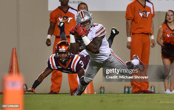 Running back Curtis Samuel of the Ohio State Buckeyes catches a touchdown pass while being defended by cornerback Greg Stroman of the Virginia Tech...