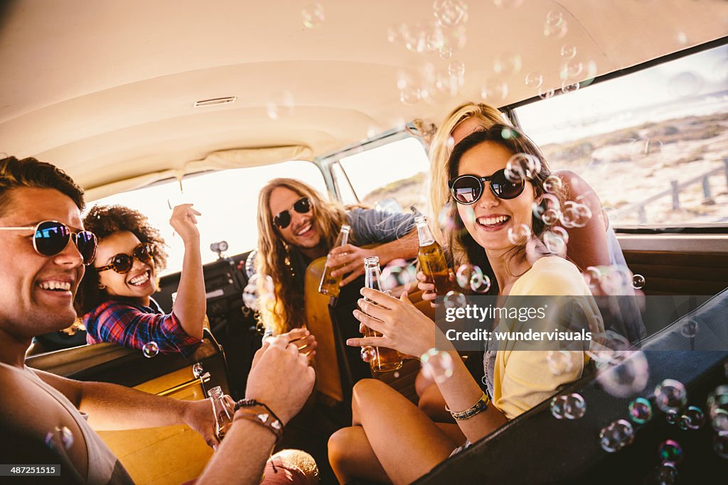 Friends blowing bubbles on roadtrip