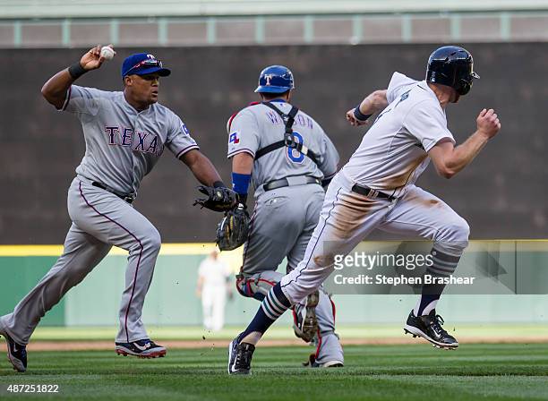 Third baseman Adrian Beltre of the Texas Rangers catches Brad Miller of the Seattle Mariners in a run-down during the fifth inning of a gamge at...