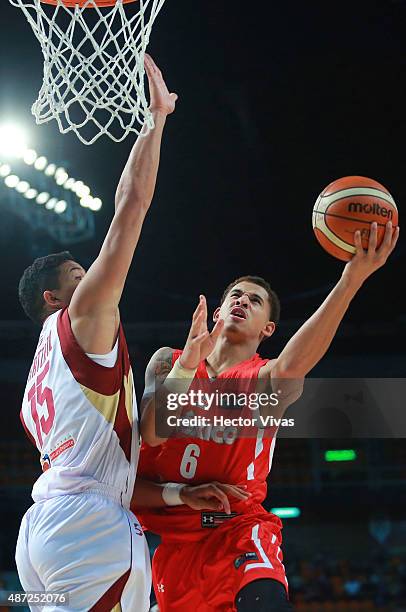 Juan Toscano of Mexico attempts to shoot against Windi Graterol of Venezuela during a second stage match between Venezuela and Mexico as part of the...