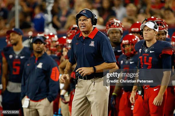 Head coach Rich Rodriguez of the Arizona Wildcats rects during the college football game against the UTSA Roadrunners at Arizona Stadium on September...