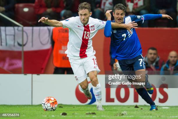 Maciej Rybus and Lee Casciaro during the UEFA Euro 2016 Qualifying Round match between Poland and Gibraltar at the National Stadium on September 7,...