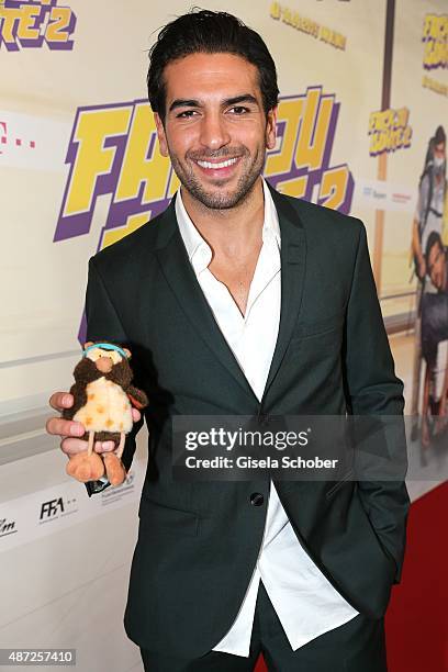 Elyas M'Barek with 'Frieda' during the world premiere of 'Fack ju Goehte 2' at Mathaeser Kino on September 7, 2015 in Munich, Germany.