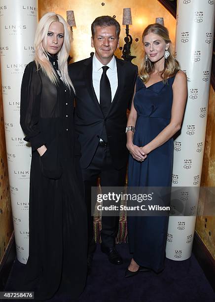 Poppy Delevigne, George Koutsolioutsos and Donna Air attend the Links Of London 25th Anniversary Event at Loulou's on September 7, 2015 in London,...
