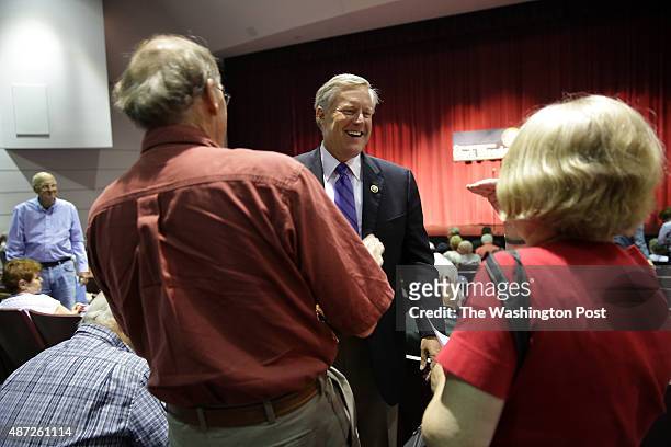 Congressman Mark Meadows , center, greets constituents before leading a Town Hall meeting at Blue Ridge Community College in Flat Rock, NC on Friday,...