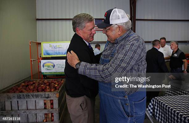 Congressman Mark Meadows , left, chats with Henderson County Agricultural Advisory Board Chairman Theron Maybin during a visit to Ridgeview Apple...