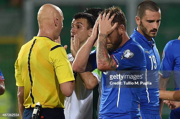 Daniele De Rossi of Italy shows his dejection after referee Sergei Karasev showed him the red card during the UEFA EURO 2016 Qualifier match between...