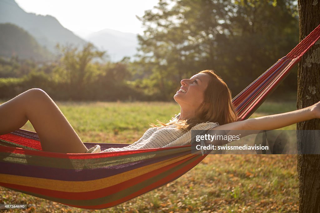 Beauty in nature, woman relaxing on hammock