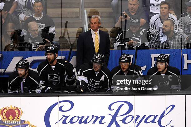 Head Coach Darryl Sutter of the Los Angeles Kings stands on the bench against the San Jose Sharks in Game Six of the First Round of the 2014 Stanley...