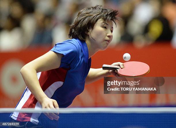 Kim Jong of North Korea serves against Elizabeta Samara of Romania during their women's singles round two match of the 2014 World Team Table Tennis...