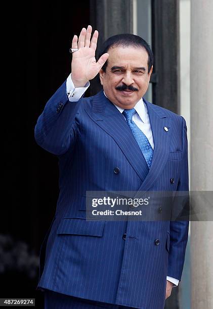 King Hamad Bin Isa Al Khalifa of Bahrain gestures after a meeting with French President Francois Hollande at the Elysee Palace on September 08, 2015...