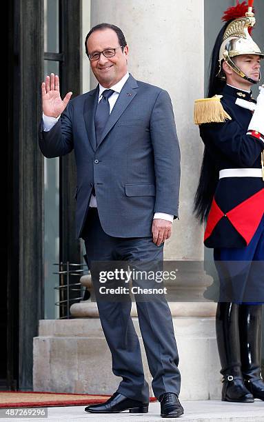 French President Francois Hollande gestures after a meeting with King Hamad Bin Isa Al Khalifa of Bahrain at the Elysee Palace on September 08, 2015...