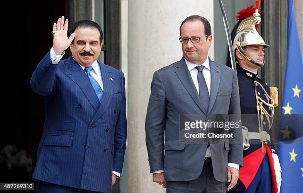 French President Francois Hollande and King Hamad Bin Isa Al Khalifa of Bahrain leave after their meeting at the Elysee Palace on September 08, 2015...