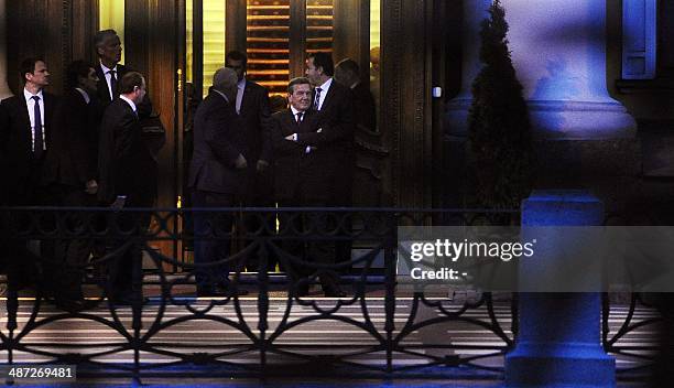 Former Germany's chancellor Gerhard Schroeder stands at the entrance to the Yuspovsky Palace in Russia's second city of St. Petersburg, late on April...