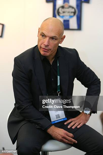 Retired referee Howard Webb talks to journalists during day four of the Soccerex Global Convention at Manchester Central on September 8, 2015 in...