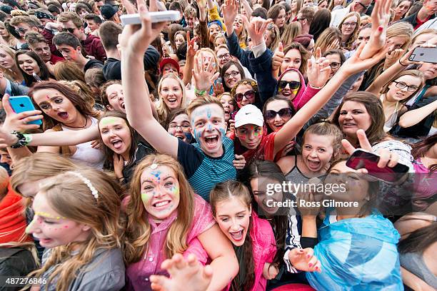 Festival goers watch Calvin Harris perform at Bellahouston Park on August 30, 2015 in Glasgow, Scotland.