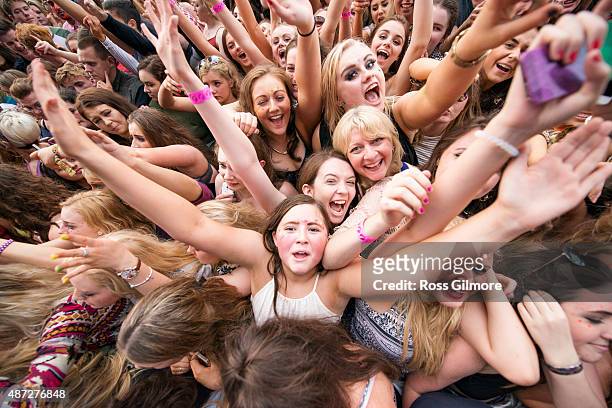 Festival goers watch Calvin Harris perform at Bellahouston Park on August 30, 2015 in Glasgow, Scotland.