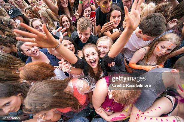 Festival goers watch Calvin Harris perform at Bellahouston Park on August 30, 2015 in Glasgow, Scotland.