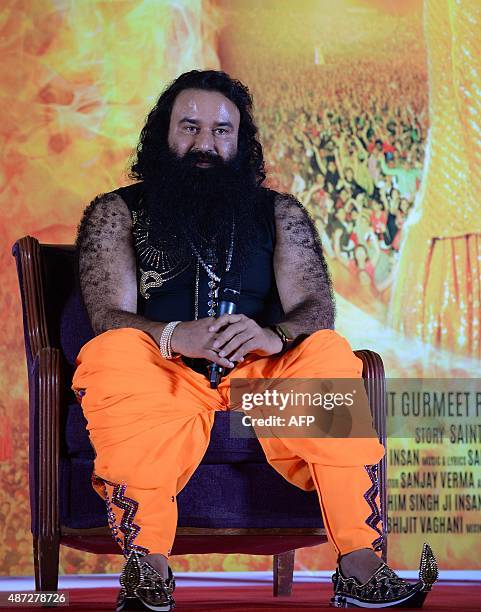 Indian chief of the religious sect Dera Sacha Sauda Gurmeet Ram Rahim Singh looks on during a news conference to launch the score for his forthcoming...