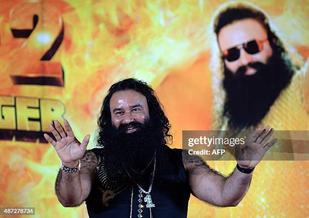 Indian chief of the religious sect Dera Sacha Sauda Gurmeet Ram Rahim Singh gestures during a news conference to launch the score for his forthcoming...