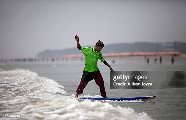 Year old Shuma competes during the annual Cox's Bazar surf competition April 24, 2014 in Cox's Bazar, Bangladesh. A group of 10-12 year old female...