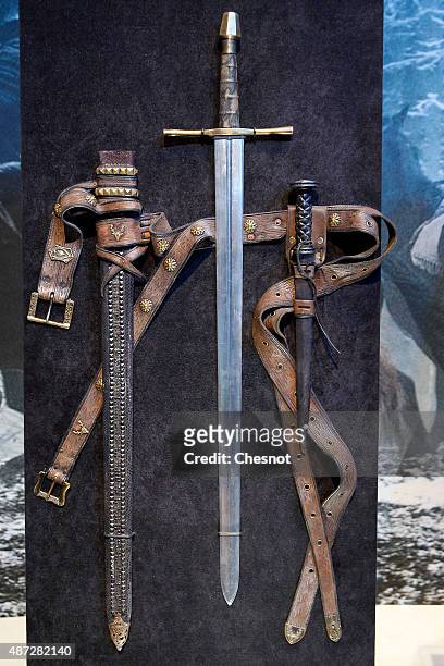 Sword and dagger of the serie "Game of Thrones" are displayed during the opening of an exhibition dedicated to HBO's television medieval fantasy...