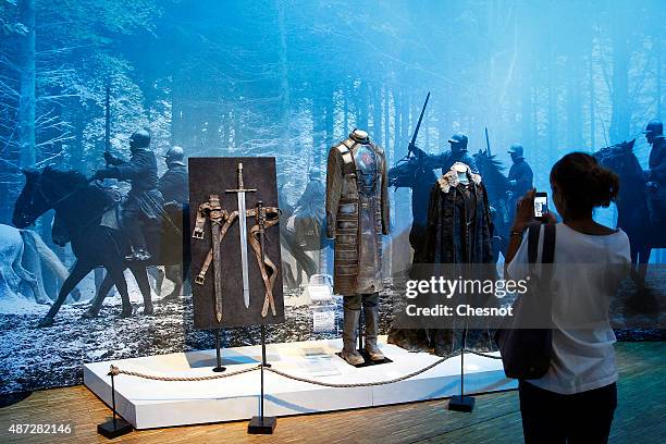 Visitor takes a picture of the costumes of the serie "Game of Thrones" during the opening of an exhibition dedicated to HBO's television medieval...