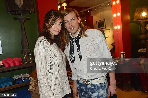 Anne Parillaud ; Christophe Guillarme attend 'Charriol': Ephemeral Boutique opening hosted by Nathalie Garcon at Galerie Vivienne on April 28, 2014...