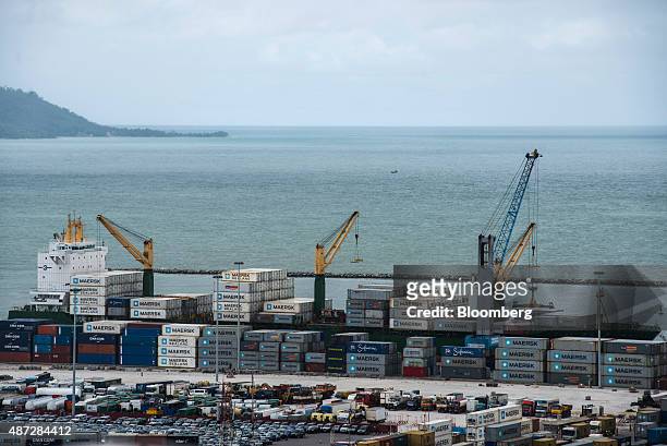 Container ship sits on the dockside during loading operations at the Port of Conakry in Conakry, Guinea, on Saturday, Sept. 5, 2015. While Guinea...