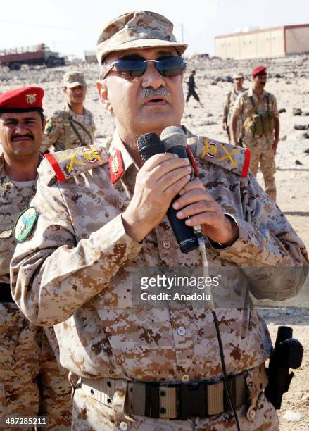Yemen's Defense Minister Major General Mohammed Nasser Ahmed speaks to military forces during his visit to troops at the military camp in Shabwa...