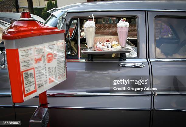 a 1950's car at a drive in restaurant - hatboro fotografías e imágenes de stock